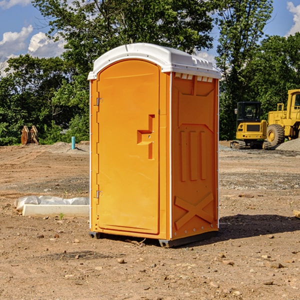 what is the cost difference between standard and deluxe portable restroom rentals in Monson